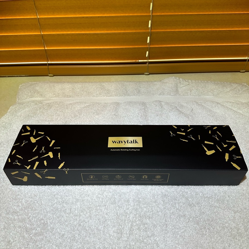 Wavy talk rotating curling iron- new